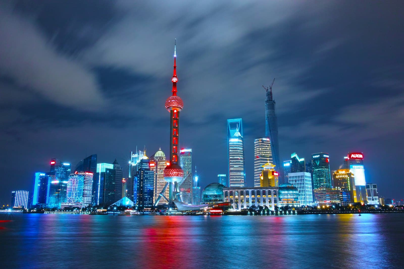 Shanghai's Pudong skyline illuminated across the Huangpu River at night